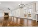 Spacious living room features built-in shelves, a fireplace, hardwood floors, and access to the backyard at 337 Ellis Preserve Sw Ln, Marietta, GA 30064