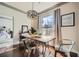 Bright dining room with wood table, metal chairs, and large window at 3777 Peachtree Ne Rd # 1335, Brookhaven, GA 30319