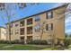 Beige multi-story building with balconies and landscaping at 3777 Peachtree Ne Rd # 1335, Brookhaven, GA 30319