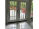 A view through the window highlights the pool and deck at 6625 Starling Sw Pl, Mableton, GA 30126