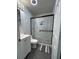 Modern bathroom featuring a sleek vanity, black framed mirror, and a glass-enclosed shower at 6625 Starling Sw Pl, Mableton, GA 30126