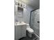 Modern bathroom features marble-style walls, a glass-enclosed shower, and a stylish vanity at 6625 Starling Sw Pl, Mableton, GA 30126