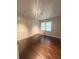 Bedroom with hardwood floors, natural light, and a closet at 6625 Starling Sw Pl, Mableton, GA 30126