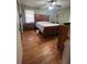 Bedroom with hardwood floors and a wooden bed frame at 6625 Starling Sw Pl, Mableton, GA 30126