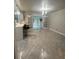 Open dining area with tile floors, seating, and kitchen access at 6625 Starling Sw Pl, Mableton, GA 30126