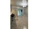 Bright dining room with stylish light fixture and a connecting door to the outdoor living space at 6625 Starling Sw Pl, Mableton, GA 30126