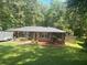 Charming brick ranch-style home with a well-manicured lawn and mature trees at 6625 Starling Sw Pl, Mableton, GA 30126