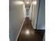 Hallway boasts hardwood floors, leading to multiple rooms and ample space at 6625 Starling Sw Pl, Mableton, GA 30126