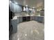Updated kitchen features custom cabinets, stainless appliances, decorative backsplash, and an eat-in island at 6625 Starling Sw Pl, Mableton, GA 30126