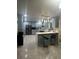 Well-equipped kitchen with stainless appliances, grey cabinets, and bar seating at 6625 Starling Sw Pl, Mableton, GA 30126