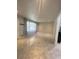 Bright, spacious living room featuring sleek tile floors and large windows at 6625 Starling Sw Pl, Mableton, GA 30126