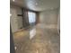 Bright living room features large-format tile flooring, recessed lights, and abundant natural light at 6625 Starling Sw Pl, Mableton, GA 30126