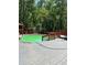 This large backyard pool is surrounded by a gray wood deck at 6625 Starling Sw Pl, Mableton, GA 30126