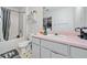 Pink vanity, white toilet and bathtub, and a shower in this bathroom at 6715 Biscayne Blvd, Rex, GA 30273