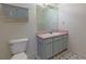 This bathroom has a vanity and toilet, as well as a wall cabinet at 6715 Biscayne Blvd, Rex, GA 30273