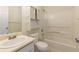 Bathroom with a tub-shower combination, toilet, and vanity with sink at 6715 Biscayne Blvd, Rex, GA 30273