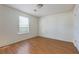 Bedroom with neutral walls, a window, and laminate flooring at 6715 Biscayne Blvd, Rex, GA 30273