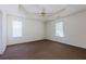 This is a bedroom with neutral walls, carpet, and a ceiling fan at 6715 Biscayne Blvd, Rex, GA 30273