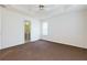 This is a bedroom with neutral walls, carpet, and a ceiling fan at 6715 Biscayne Blvd, Rex, GA 30273