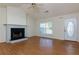 Inviting living room with hardwood floors, a fireplace, and plenty of natural light at 6715 Biscayne Blvd, Rex, GA 30273