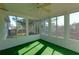 This is a sunroom that has many windows and views to the outside at 6715 Biscayne Blvd, Rex, GA 30273