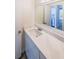Renovated bathroom with white vanity, quartz countertop and large mirror at 1107 Riverbend Club Se Dr, Atlanta, GA 30339