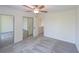 Spacious bedroom with mirrored closet and ceiling fan at 1107 Riverbend Club Se Dr, Atlanta, GA 30339