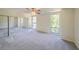 Large bedroom with wall-to-wall carpeting, mirrored closet doors and dual windows at 1107 Riverbend Club Se Dr, Atlanta, GA 30339