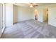 Well-lit bedroom with gray carpeting and access to a full bathroom at 1107 Riverbend Club Se Dr, Atlanta, GA 30339