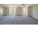 Spacious bedroom with plush carpeting, mirrored closet doors, and ceiling fan at 1107 Riverbend Club Se Dr, Atlanta, GA 30339
