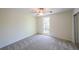 Bright bedroom with ceiling fan and mirrored closet doors at 1107 Riverbend Club Se Dr, Atlanta, GA 30339