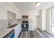 Modern kitchen with stainless steel appliances and light cabinets at 1107 Riverbend Club Se Dr, Atlanta, GA 30339