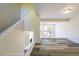 Bright living room with vaulted ceilings, hardwood floors, and lake views at 1107 Riverbend Club Se Dr, Atlanta, GA 30339