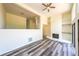 Open living room with built-in shelving and wood-look flooring at 1107 Riverbend Club Se Dr, Atlanta, GA 30339