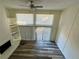 Living room with fireplace, deck access, and wood-look floors at 1107 Riverbend Club Se Dr, Atlanta, GA 30339