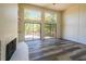 Spacious living room with fireplace, deck access, and hardwood floors at 1107 Riverbend Club Se Dr, Atlanta, GA 30339