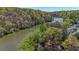 Riverfront property with wooded backdrop at 1107 Riverbend Club Se Dr, Atlanta, GA 30339