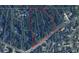 Aerial view showing a large lot with surrounding homes and roads at 251 Mount Vernon Ne Hwy, Atlanta, GA 30328