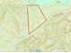 Aerial view showcasing a sizable wooded lot near residential properties at 251 Mount Vernon Ne Hwy, Atlanta, GA 30328