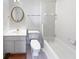 Clean bathroom with tub, toilet, and vanity at 3905 Colonial Sw Trl, Lilburn, GA 30047