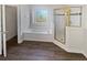 Bathroom with a soaking tub, a stained glass window, and separate shower stall at 3905 Colonial Sw Trl, Lilburn, GA 30047