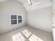 Simple bedroom with plush carpet, neutral walls, and a large window at 3905 Colonial Sw Trl, Lilburn, GA 30047