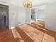 Bright dining room with hardwood floors and chandelier at 3905 Colonial Sw Trl, Lilburn, GA 30047
