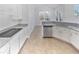 Modern kitchen with granite countertops and white cabinets at 3905 Colonial Sw Trl, Lilburn, GA 30047