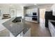 Kitchen boasts granite countertops and stainless steel appliances at 3905 Colonial Sw Trl, Lilburn, GA 30047