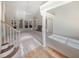 Spacious living room with hardwood floors, fireplace, and large windows at 3905 Colonial Sw Trl, Lilburn, GA 30047