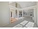 Spacious living room with high ceilings and large windows at 3905 Colonial Sw Trl, Lilburn, GA 30047