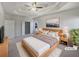 Large main bedroom with walk-in closet and ceiling fan at 3905 Colonial Sw Trl, Lilburn, GA 30047