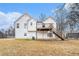 White house exterior with raised deck and stairs, and a large backyard at 126 Millers Dr, Dallas, GA 30157