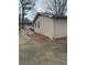 Side yard with driveway and mature trees at 256 New Hope Rd, Lawrenceville, GA 30046